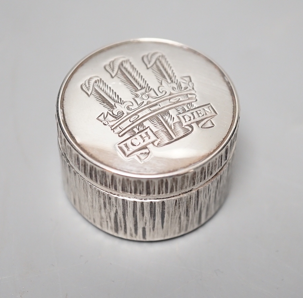 Adrian Gerald Benney- A modern textured silver pill box, engraved with the Prince of Wales feathers, London, 1997